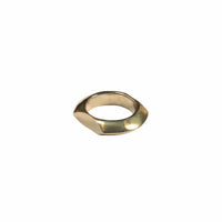 Gold ring with a geometric design on a light gray background