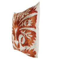 Orange and white patterned decorative pillow.