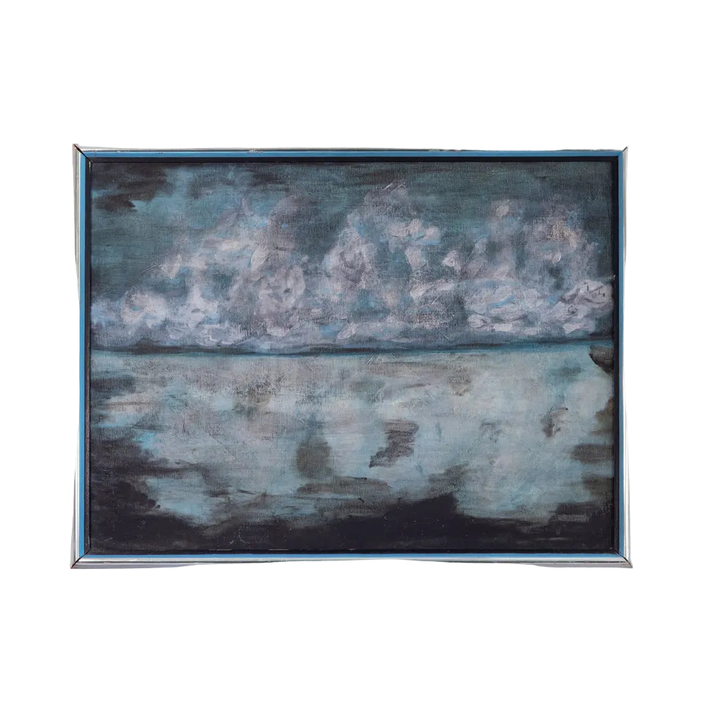 A framed landscape painting depicting a cloudy sky and water reflection, mounted on a plain white wall.