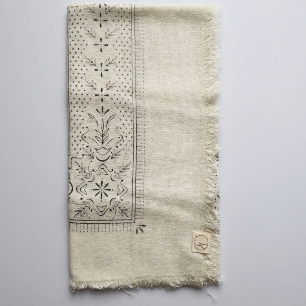 Textile with intricate patterns on a plain background