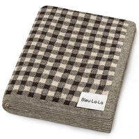 Folded checkered blanket with 'Bleu-La-La' label on a white background