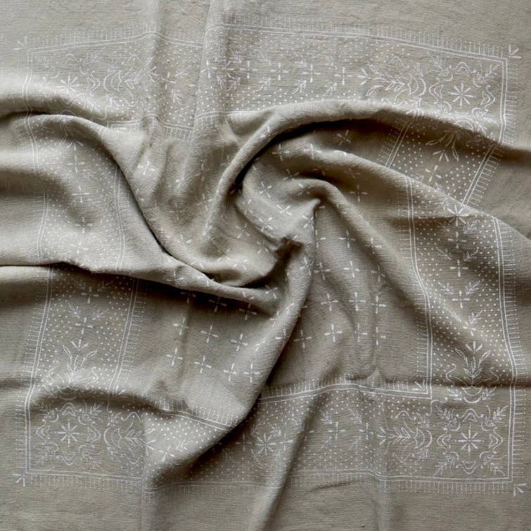 Textured fabric with subtle patterns on a neutral background