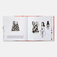 Open book with illustrations of women in polka dot dresses on a white background