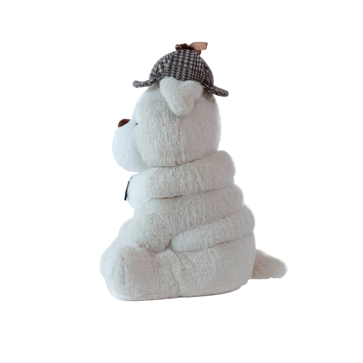 Plush toy dog wearing a checkered hat on a white background