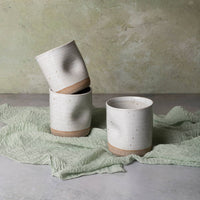 three cups with divots