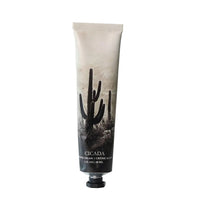 Hand cream tube with cactus design on a light background
