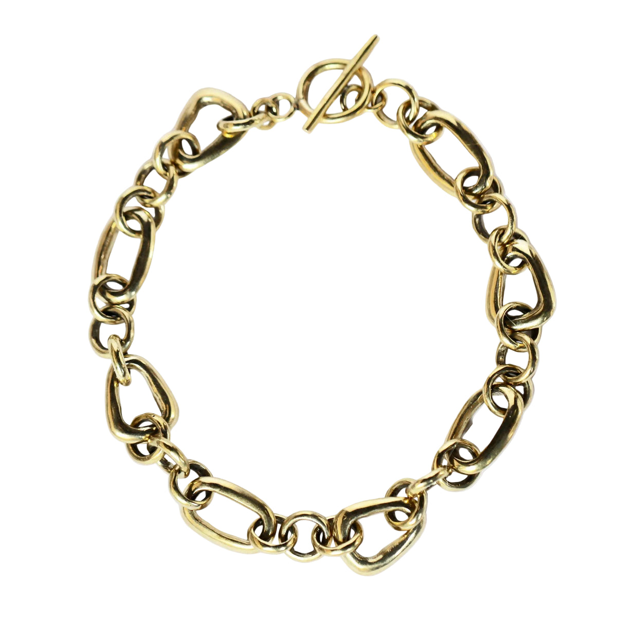 A gold-toned chain link bracelet with a toggle clasp, displayed on a clean white background.