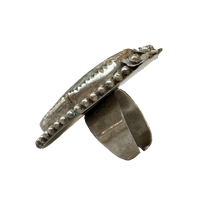 Silver ring with bead detailing on a white background