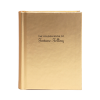 The Golden Book of Fortune-Telling with a metallic gold cover and black text, shown on a plain white background.