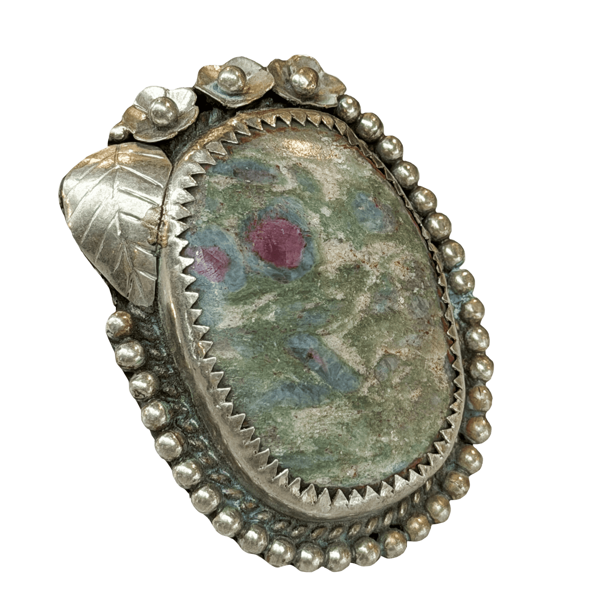 Silver ring with an oval stone featuring floral patterns on a white background