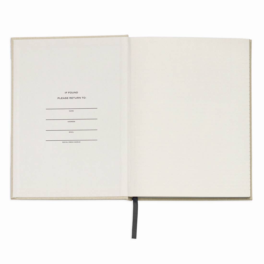 Open notebook with a blank page and text on a white background