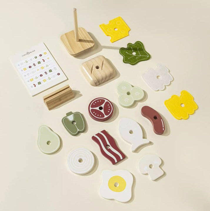 Set of wooden food-shaped toys on a beige background